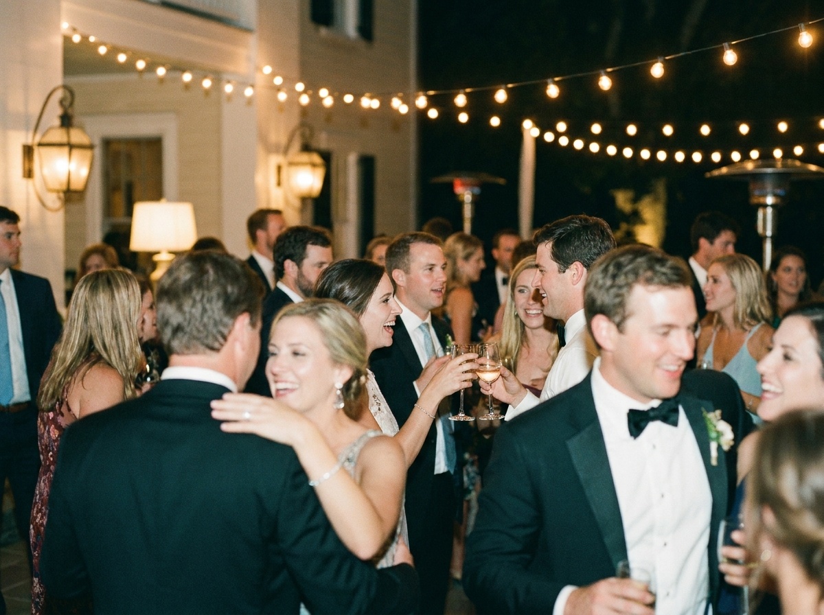 Guests socializing at an outdoor evening event